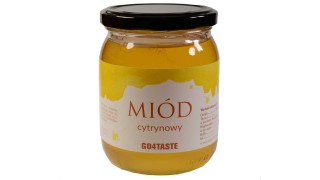 Miód cytrynowy 650g w słoiku na białym  tle