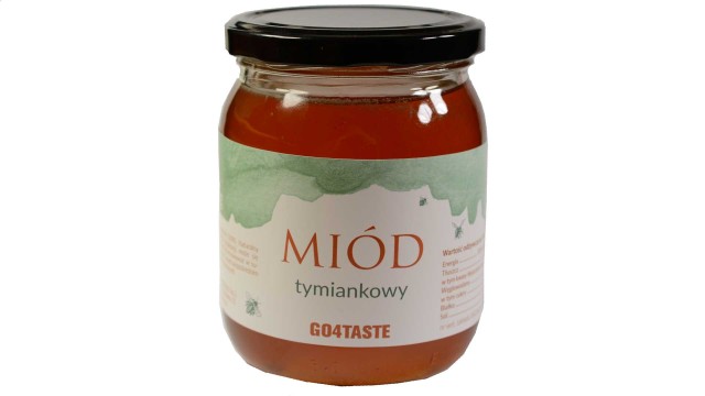 Miód tymiankowy 650g w słoiku na białym tle